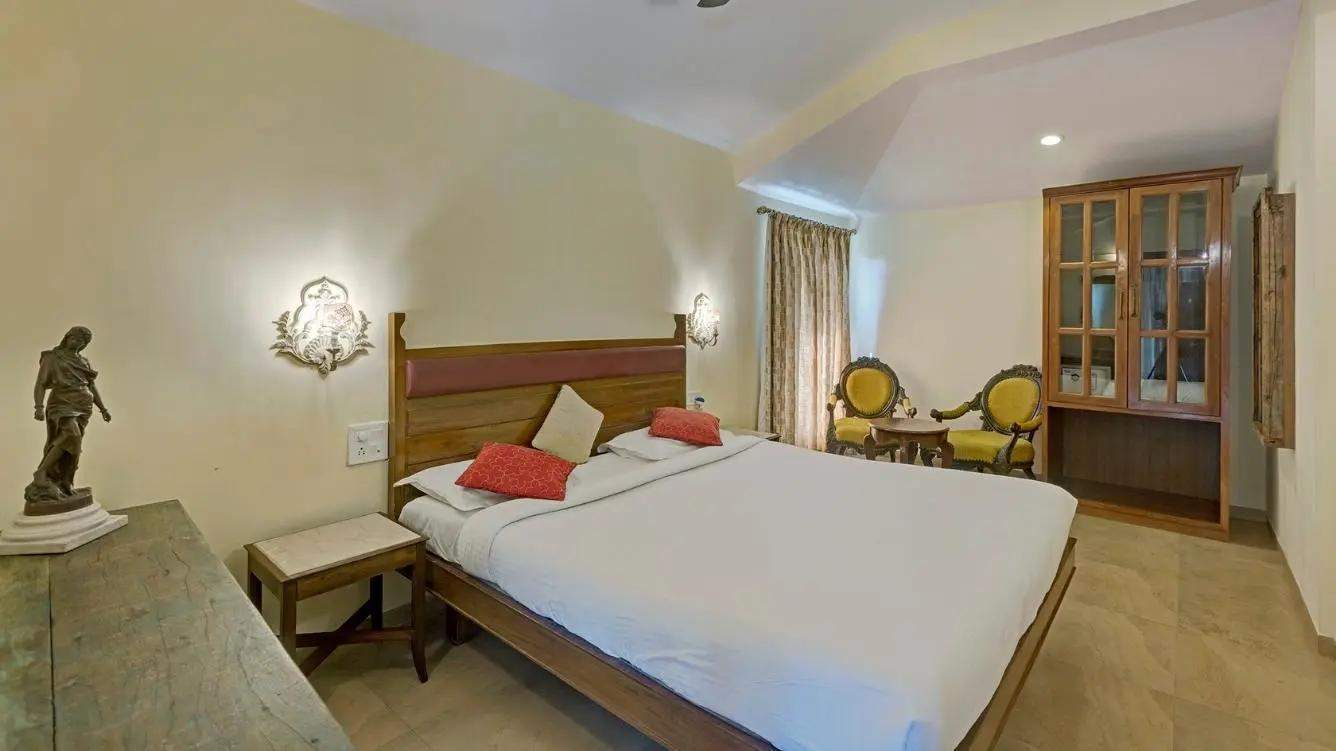 Comfortable family suite with main bedroom and connected children's room featuring forest views at Ramsukh Resort in Mahabaleshwar